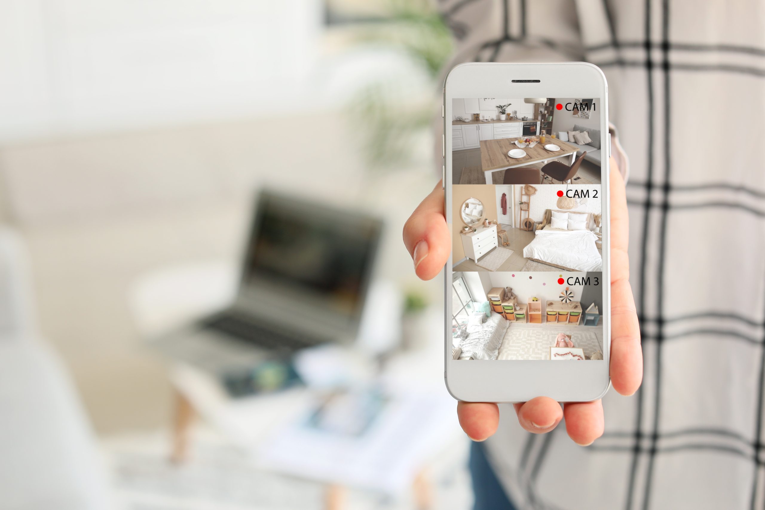 Woman,Showing,Mobile,Phone,With,Images,Of,Cctv,Cameras,Installed